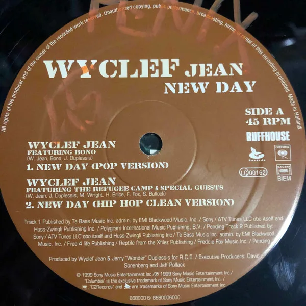 Album cover for New Day by Wyclef Jean Featuring Bono