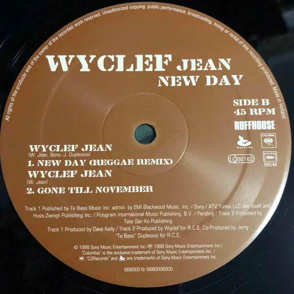Album cover for New Day by Wyclef Jean Featuring Bono